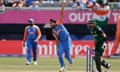 India's Arshdeep Singh, center, bowls a delivery during the ICC Men's T20 World Cup cricket match between India and Pakistan at the Nassau County International Cricket Stadium in Westbury, New York, Sunday, June 9, 2024. (AP Photo/Adam Hunger)