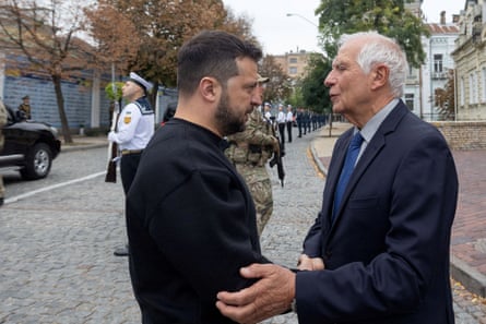 Ukraine’s president Volodymyr Zelenskiy speaks with European Union foreign policy chief Josep Borrell as they visit the Memory Wall of Fallen Defenders of Ukraine in Kyiv on Sunday.