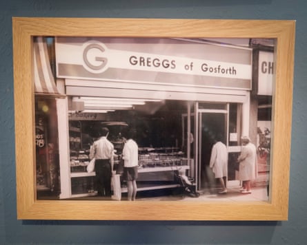 A framed black and white photo of a bakers, probably in the 1970s