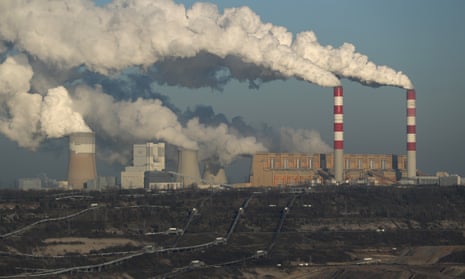 Steam and smoke rise from a coal-fired power station in Poland