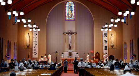 People attend an early morning mass at Urakami cathedral in Nagasaki, Japan, on Saturday to mark 80 years since the atomic bomb was dropped.