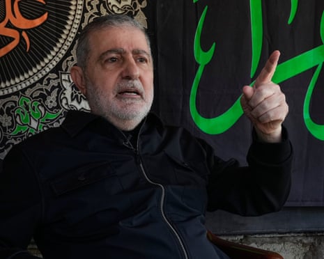 Wafiq Safa, a senior Hezbollah political council member, gestures during the AP interview in Beirut