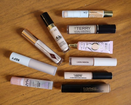 Ten tubes of concealer on a tabletop