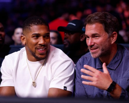 Anthony Joshua is seen with promoter Eddie Hearn ahead of the Derek Chisora v Deontay Wilder fight
