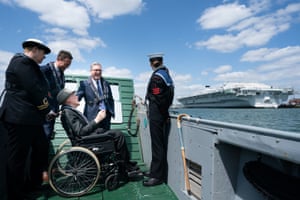 Keir Starmer, with the second world war veteran Len Chivers in a wheelchair, with three others, on board a landing craft in Portsmouth harbour