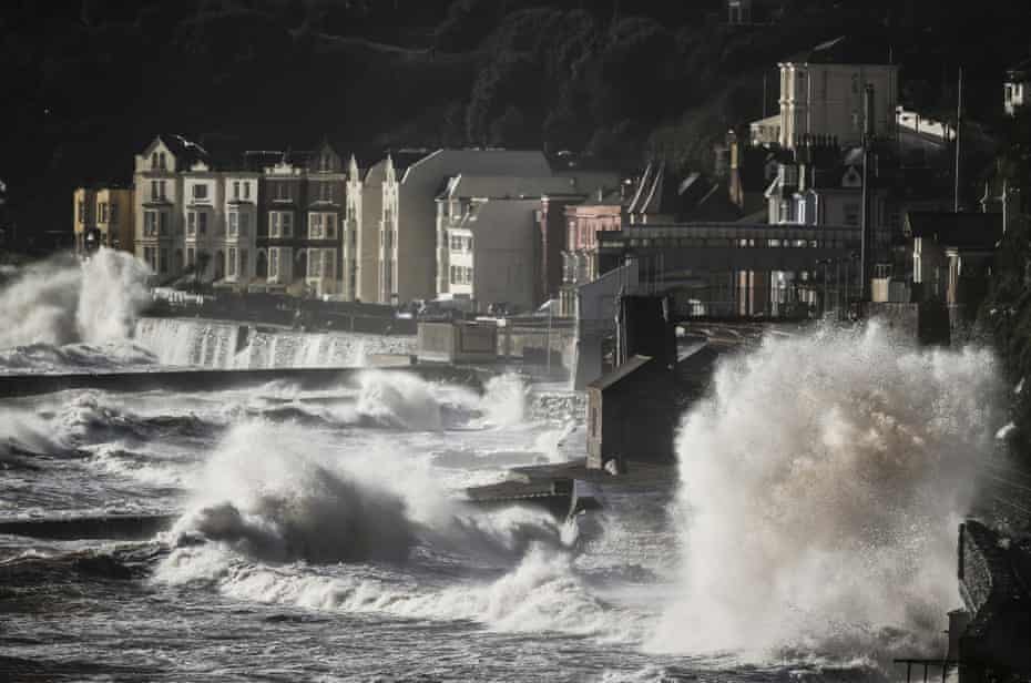 Waves crash over the main Exeter to Plymouth railway line that was closed after parts of it were washed away by the sea in 2014 in Devon, south-west England