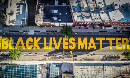 A mural covers a street in Brooklyn, New York during protests against racism in the city in June.