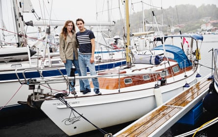 Maya Eliza and her husband Aladino standing on the deck of a boat in Sweden.