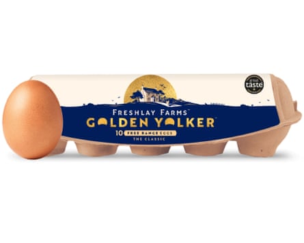 An egg rests against the side view of a box of Freshlay golden yolks free-range eggs