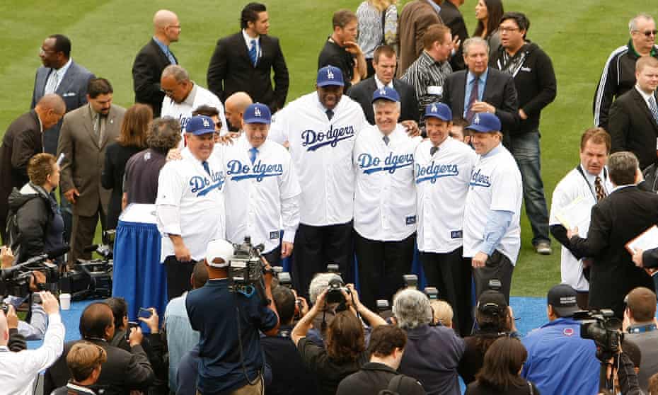 The ownership group that rturned the LA Dodgers fortunes 10 years ago from left: Bobby Patton, Stan Kasten, Earvin 'Magic' Johnson, Mark R Walter, Peter Guber and Todd Boehly.