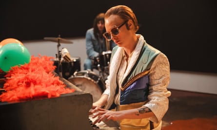 Cara Delevingne at the piano playing Elton John