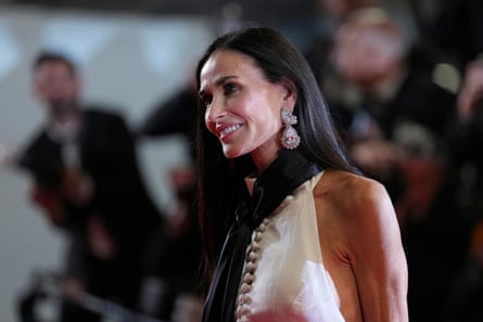 Demi Moore poses for photographers