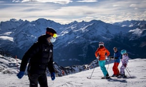 Skiers wearing face masks in Verbier in November.