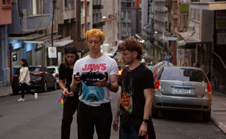 Marcio Reolon in Jaws T-shirt and Filipe Matzembacher, right, on location for Night Stage in 2023.