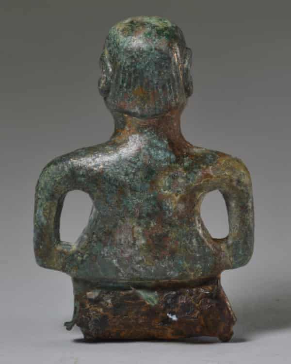 Celtic figure, rear view.