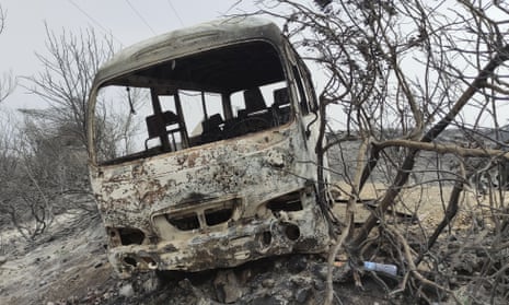 A charred bus that was caught up in the wildfire in El Tarf province, near the Algerian-Tunisian border
