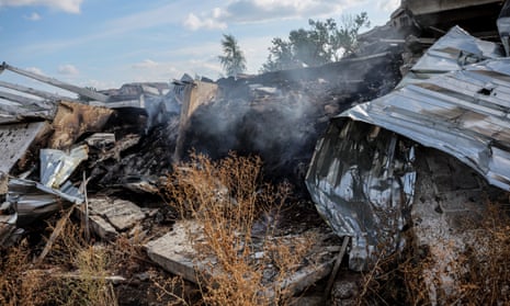 Seeds burn in a grain storage destroyed during combat in the village of Dovhenke in the Kharkiv region