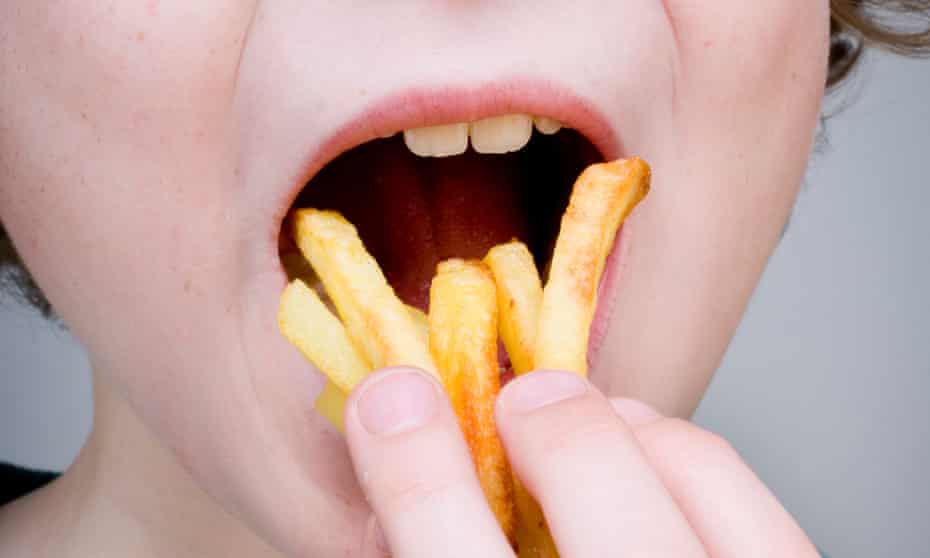 A child eating chips