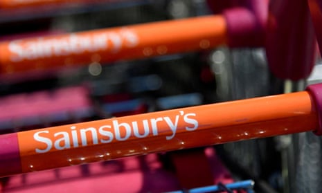 Branding is seen on a shopping trolley at a branch of Sainsbury's