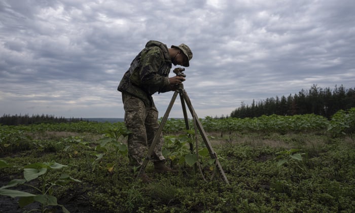 A Ukrainian serviceman looks though the aiming circle before shooting by MSLR BM-21 “Grad” toward Russian positions at the frontline in Kharkiv region, Ukraine, on Tuesday, Aug. 2, 2022.(AP Photo/Evgeniy Maloletka)