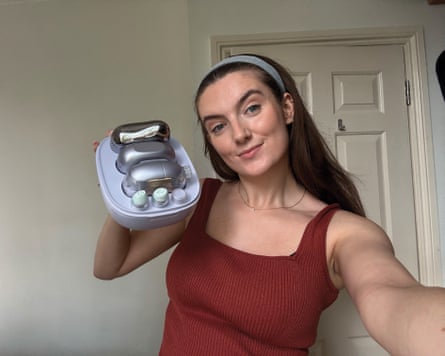 The writer holding the Shark facialpro glow in its case