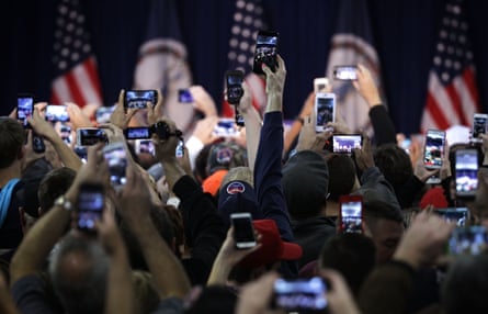 Supports hold up camera phones at a Trump rally in Virginia.