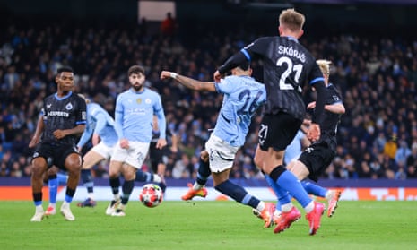 Savinho scores Manchester City’s third goal against Club Brugge: he is pictured side-on kicking the ball as teammate Josko Gvardiol faces him and Brugge's Michal Skoras comes up from behind