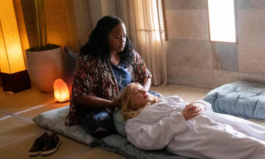 Natasha Rothwell as Belinda, giving a hotel guest a beauty treatment