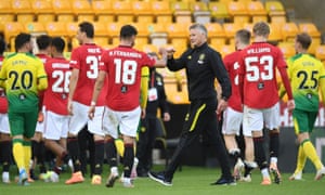 Ole Gunnar Solskjær congratulates his players after their win at Norwich on Saturday