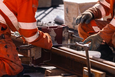 Engineers installing tram rails