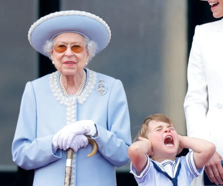 Queen Elizabeth II and Prince Louis watch a flypast from the balcony of Buckingham Palace.