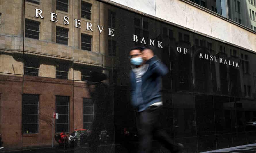 A pedestrian passes the Reserve Bank of Australia head office in Sydney.