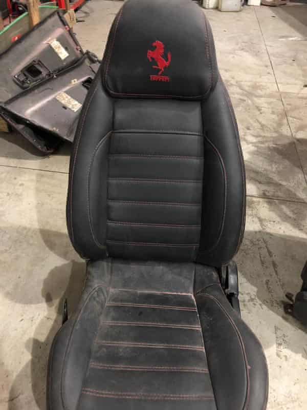 A photo released by police shows a car seat embroidered with a fake Ferrari logo.