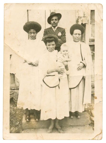 Tsedek Banjaw (middle) and her sisters Abebech (right) Yeshi Gebereyes, a talented Kirar (traditional string instrument) player (left) with their baby brother Zewdu, in 1947