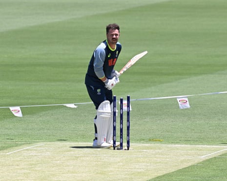 Travis Head inspects the pitch at the Gabba before play starts on day one of the second Ashes Test
