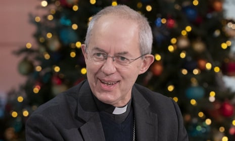Justin Welby in front of Christmas tree