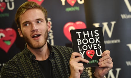 Swedish video game commentator Felix Kjellberg, aka PewDiePie poses with his new book, This Book Loves You.