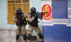 Haiti unrest: armed gangs target international airport after mass jailbreak - video report
