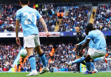 Jérémy Doku shoots to score Manchester City’s opening goal.