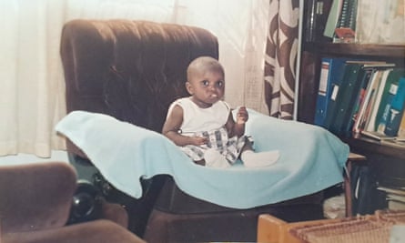 A baby Elizabeth Odondi sat in an armchair.