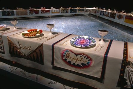 Installation view of Wing One, featuring Judith and Sappho, place settings from The Dinner Party, 1979, by Judy Chicago. The installation consists of a triangular banqueting table that represents 1,038 women in history 