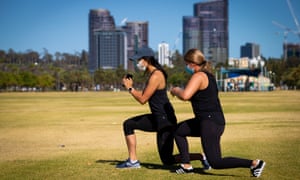 People exercise outdoors on Monday on the first day of WA’s Covid lockdown.