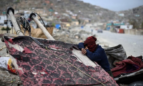 An Afghan garbage collector take rest at a rubbish dumping site
