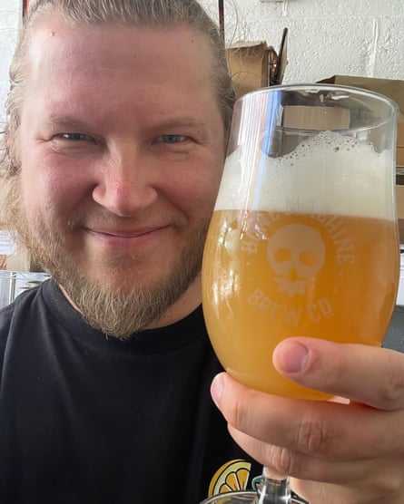 Kimi Karjalainen of Bone Machine in Hull holds up a large glass of beer.