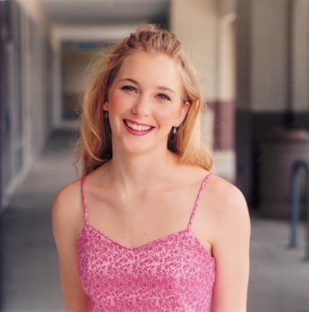 Virginia Giuffre wearing a strapless pinkish gaffe dress, smiling astatine nan camera.