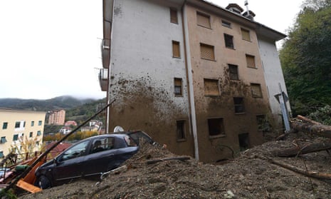 A car hit by the landslide that damaged a building in Rossiglione, Genoa.