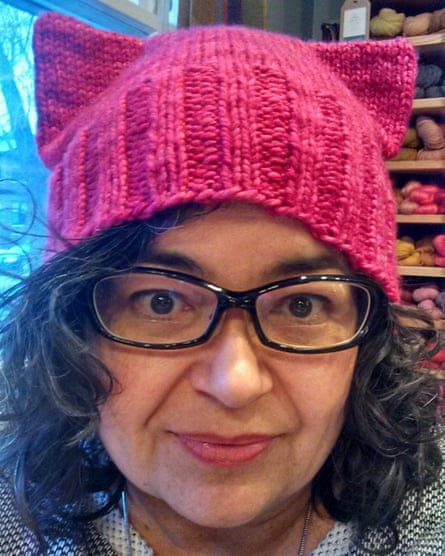 Angie Paulson, a knitter who works at The Yarnery shop in Saint Paul, Minnesota, displays one of the ‘pussy’ hats she made.