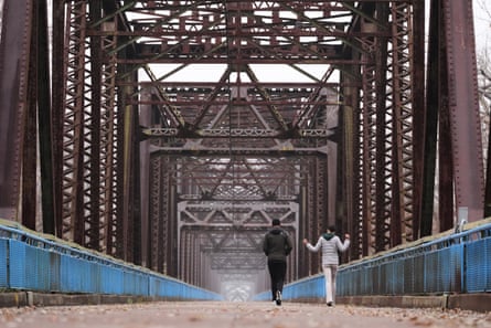 People walk along the traffic-free Chain of Rocks Bridge