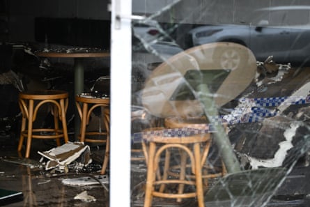 Damage to And Bodega as Victoria Police establish a crime scene.