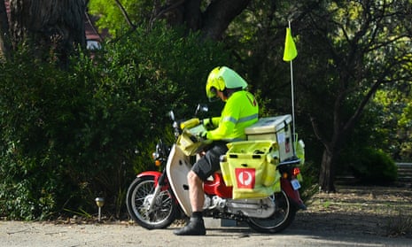 Mail is delivered by an Australia Post employee in Canberra, Thursday, 2 March, 2023.